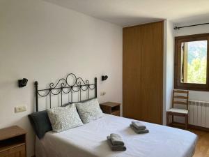 Ένα ή περισσότερα κρεβάτια σε δωμάτιο στο Acogedora Morada de Montaña