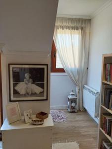 a living room with a picture of a bride at MC LAGOS, Bueu in Pontevedra +5 photos