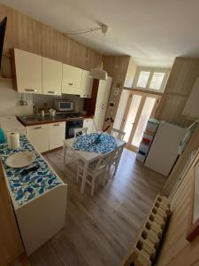 a kitchen and dining room with a table and chairs at Da Nonna Puni in Orvieto +3 photos