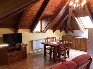 Televízia a/alebo spoločenská miestnosť v ubytovaní Casa Valentí