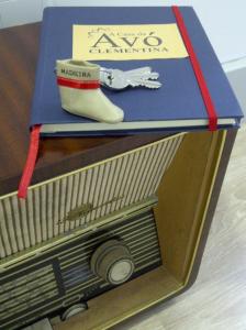 a box with a model of a tv and a rubber boot at Casa Da Avo Clementina in Funchal