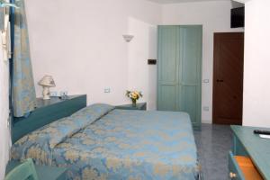 Postel nebo postele na pokoji v ubytování Hotel La Ninfea