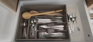 a drawer filled with utensils in a box at Veronika's House je prijeten, miren apartma v naravi, blizu mesta in Celje