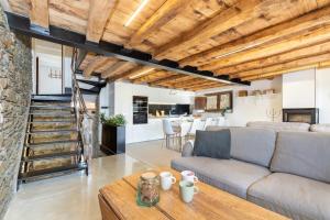 a living room with a couch and a table at El Roure in Molló