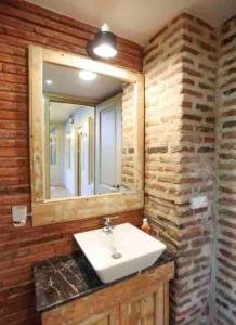 a bathroom with a sink and a mirror at Angels Roof - Betlemi. Garden & View over Old Tbilisi in Tbilisi City