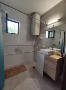 a bathroom with a sink and a mirror at Park 1 MARKO FREE PARKING in Vranje
