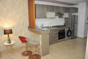 a kitchen with a counter with a stove and a microwave at Casa Pedro in Casablanca