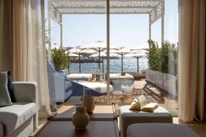 a living room with a view of the ocean at Yalikavak Marina Hotel By Social Living Collection in Yalıkavak