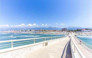 a view of a beach with people and the water at 3 Bedroom Lovely Home In Marina Di Pietrasanta in Marina di Pietrasanta