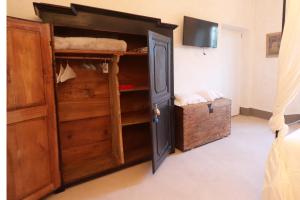 a bedroom with a bunk bed and a tv at B&B Tricudai in Agliano Terme