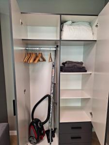 a walk in closet with a chainsaw in it at Mooie studio 14 C in center in Rotterdam