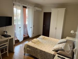 Postel nebo postele na pokoji v ubytování Le Pavoncelle