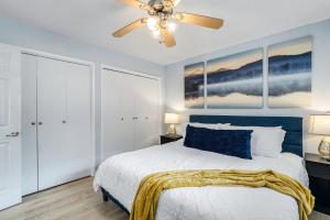a bedroom with a bed and a ceiling fan at Sweet Haven - Home with EV Charger near Yosemite in Groveland