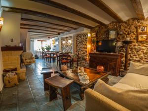 a living room with a couch and a table at La Aldea Encantada in Quintanilla del Monte