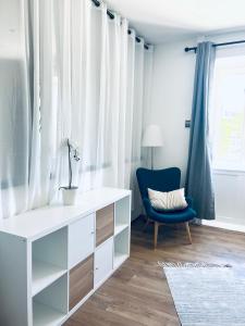 a white desk and a blue chair in a room at Maison EL&AR - Place de la Comédie, Wifi in Montpellier