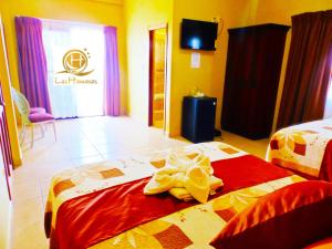 Postel nebo postele na pokoji v ubytování Hotel Las Hamacas