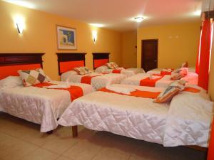 Postel nebo postele na pokoji v ubytování Hotel Las Hamacas