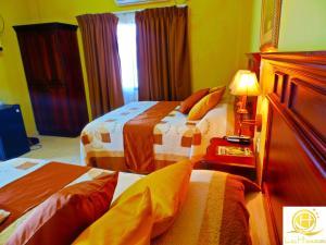 Postel nebo postele na pokoji v ubytování Hotel Las Hamacas