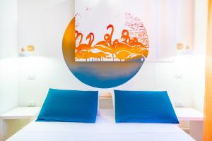 Postel nebo postele na pokoji v ubytování Sunscape Rooms Cagliari City Center