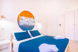 Postel nebo postele na pokoji v ubytování Sunscape Rooms Cagliari City Center
