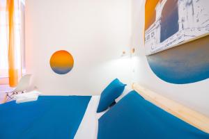 Postel nebo postele na pokoji v ubytování Sunscape Rooms Cagliari City Center