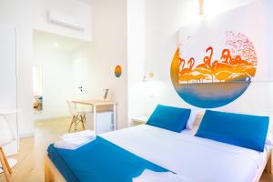Postel nebo postele na pokoji v ubytování Sunscape Rooms Cagliari City Center