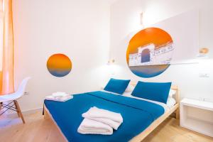 Postel nebo postele na pokoji v ubytování Sunscape Rooms Cagliari City Center
