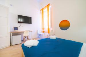 Postel nebo postele na pokoji v ubytování Sunscape Rooms Cagliari City Center
