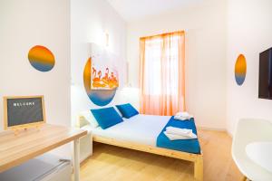 Postel nebo postele na pokoji v ubytování Sunscape Rooms Cagliari City Center