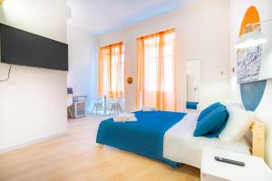 Postel nebo postele na pokoji v ubytování Sunscape Rooms Cagliari City Center