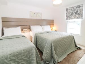 Katil atau katil-katil dalam bilik di The Blue Cottage