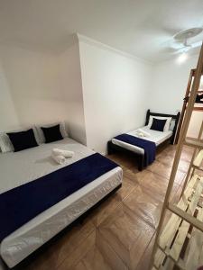 Un pat sau paturi într-o cameră la Hostel Passa4
