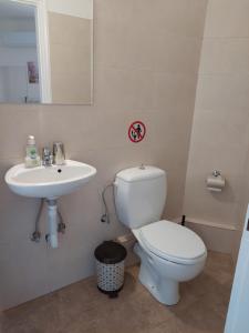 a bathroom with a toilet and a sink at PlazaVerrosA6Room in Tripoli +6 photos