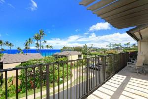 a balcony with a view of the ocean at WAILEA ELUA, #1508 condo in Wailea +29 photos