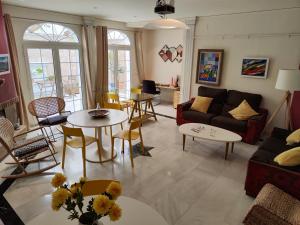 a living room with a couch and a table at Balcón de la Villa in Priego de Córdoba