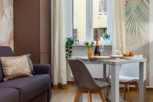 a living room with a table and a couch at Exotic House in central of Milan in Milan +12 photos