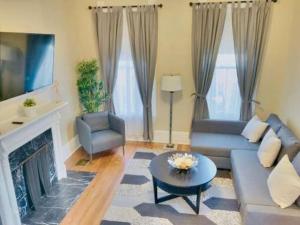 a living room with a couch and a fireplace at Frankfort 1 (V2) in Columbus