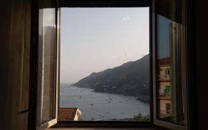 a window with a view of a body of water at Mareterè in Vietri