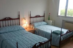 Säng eller sängar i ett rum på Casa rural a las afueras de Gijón