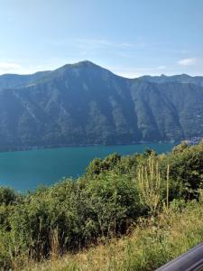 a view of a lake with mountains in the background at LANZO IN CORTE APPARTAMENTO in Lanzo dʼIntelvi