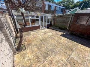 a patio in front of a house at The Quiet Sanctuary - 4 Bedroom in Swindon