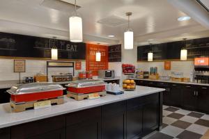 a fast food restaurant with three trays of food on a counter at Hampton Inn & Suites Clearwater/St. Petersburg-Ulmerton Road in Clearwater