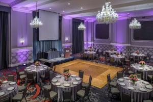 a banquet hall with tables and chandeliers at Embassy Suites by Hilton Portland Downtown in Portland