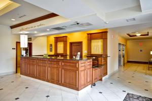 a large lobby with a bar in the middle at Hilton Garden Inn Tampa Northwest/Oldsmar in Oldsmar