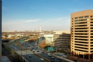 a view of a city with a highway and buildings at Embassy Suites by Hilton Crystal City National Airport in Arlington