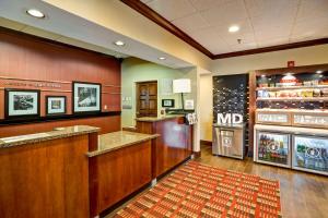 a mcdonalds restaurant with a counter and a refrigerator at Hampton Inn Baltimore/Glen Burnie in Glen Burnie