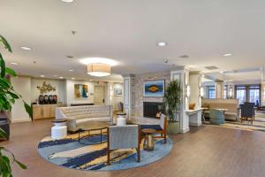 a lobby with a couch and a fireplace at Homewood Suites by Hilton Windsor Locks Hartford in Windsor Locks