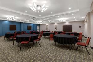 a conference room with tables and chairs and a podium at Hampton Inn & Suites Seattle/Federal Way in Federal Way +54 photos