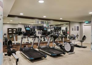 a gym with many exercise equipment in a room at Hampton By Hilton Dublin City Centre in Dublin