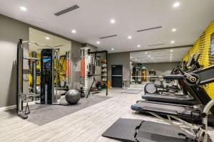 a gym with treadmills and machines in a room at Hampton by Hilton High Wycombe in High Wycombe